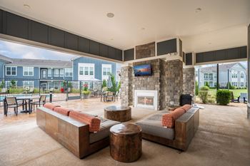Outdoor fireplace with lounge area